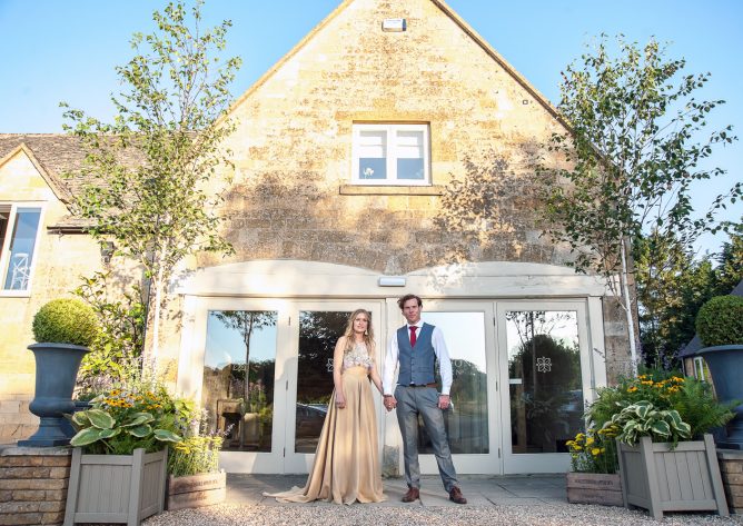 The first bride and groom at the front door of this new Cotswold wedding venue. Photo: Rachel Jones Photography