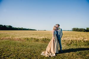 Bride and groom enjoying the amazing Cotswold views from this beautiful wedding venue