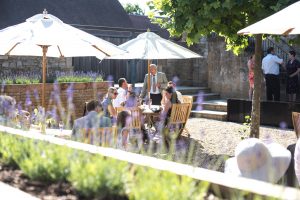 Guests enjoying drinks and canapes in the courtyard