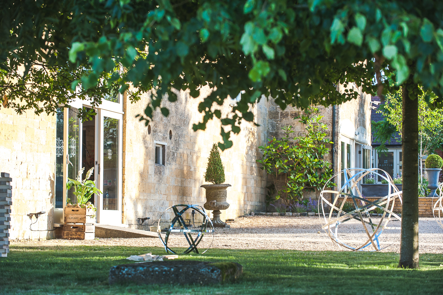 Morning sun shining on the front of Cotswold barn wedding venue