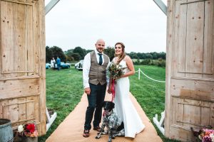 Bride and groom at the entrance to their wedding marquee