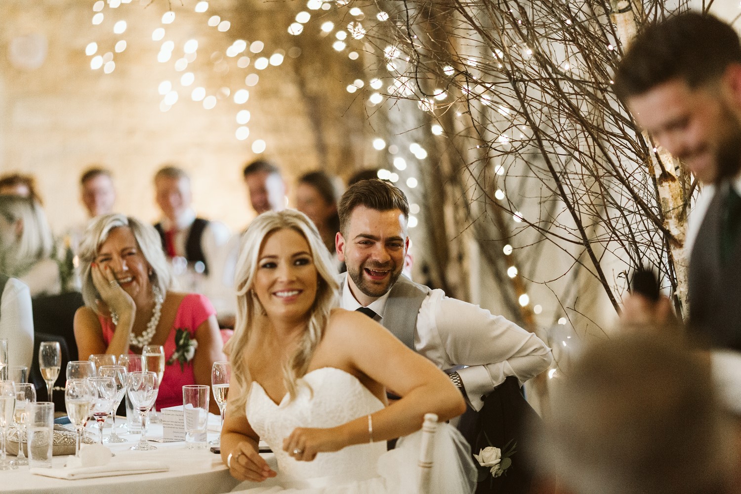 Bride and groom listening to speeches