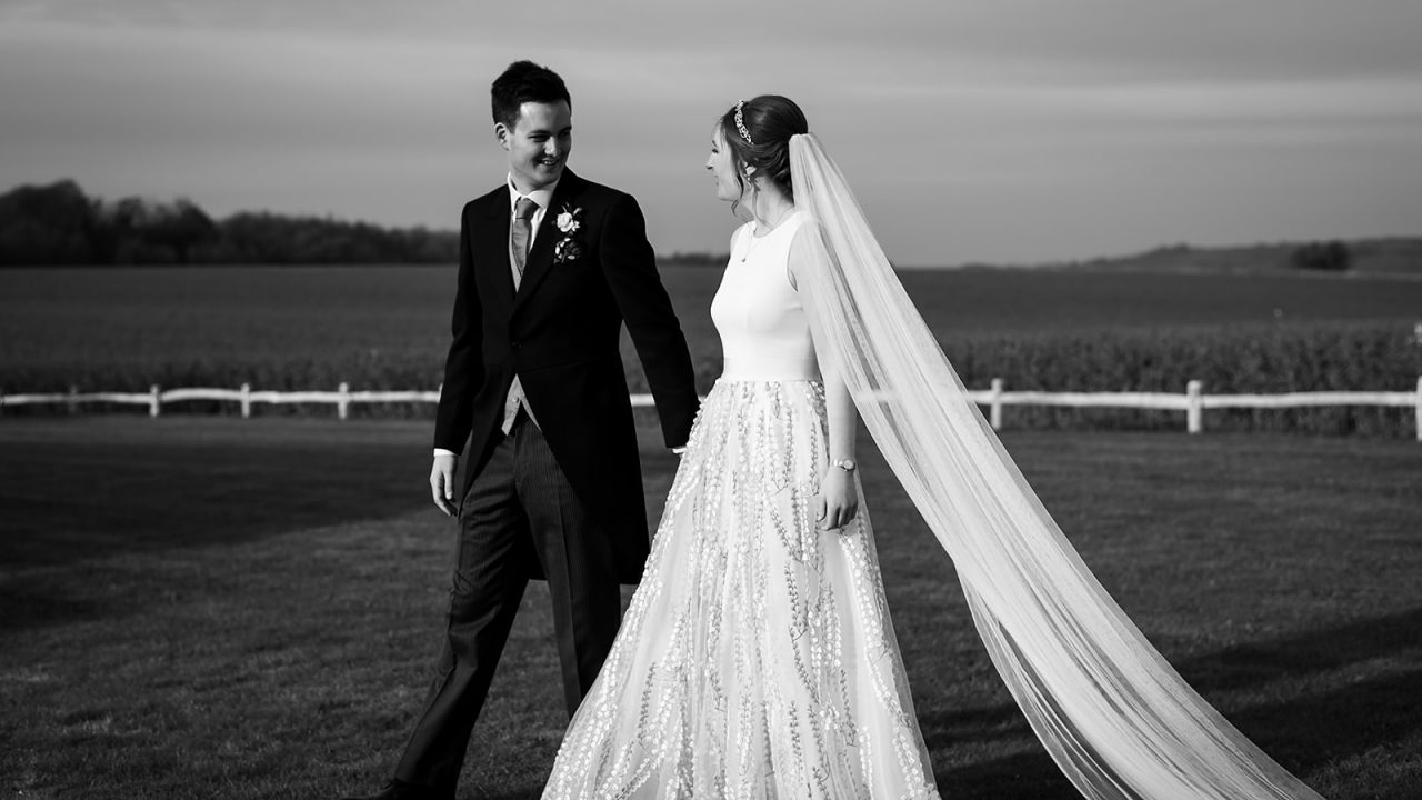 Bride and groom walking in the grounds