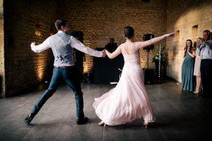 Bride and groom dancing their first dance routine during the wedding reception. Photography: Katie Hamilton Photography