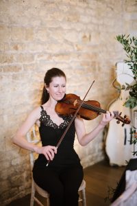 Classical violinist playing during the wedding ceremony