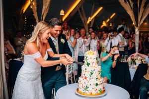 Bride and groom cutting their wedding cake