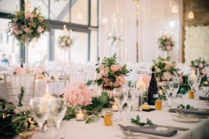 Wedding breakfast table decorated with pink flowers