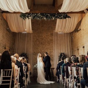 Bride and groom exchanging vows on their wedding day