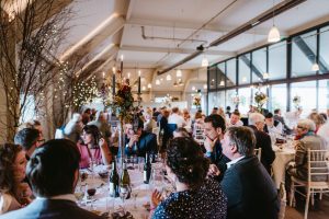 Round tables set for the wedding breakfast