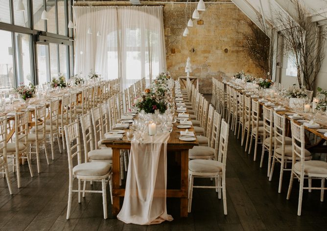 Long tables set for the wedding breakfast
