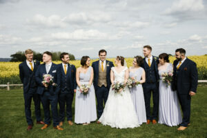 Formal shot of the bridal party outside