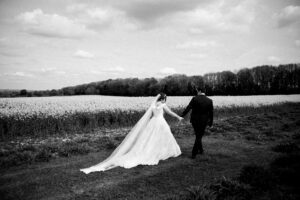 Bride and groom walking hand in hand