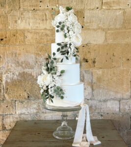 Four tier wedding cake with iced flowers