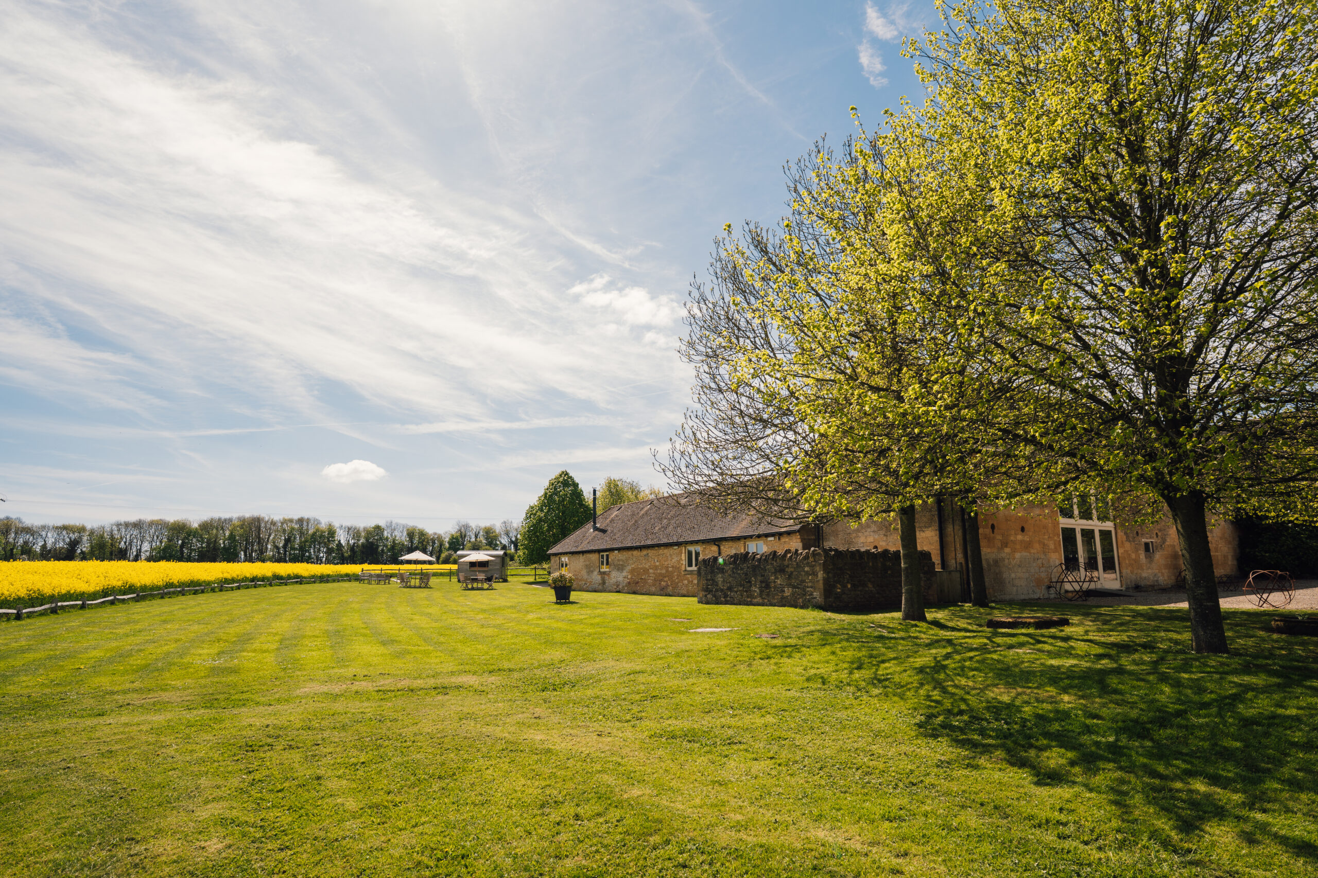 Extensive gardens and rolling Cotswold countryside surrounds Lapstone Barn